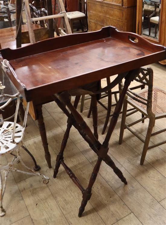 A Victorian mahogany butlers tray on folding stand Tray 77cm